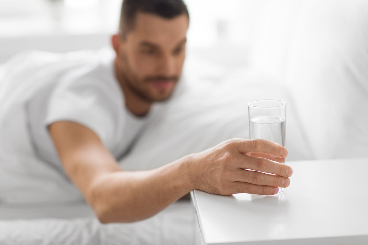young man thirsty at night
